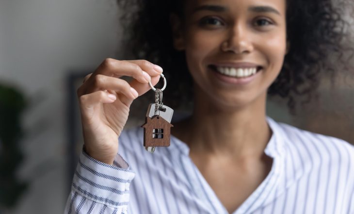 Focus,On,Keys,In,Female,Hands,,Smiling,Young,African,American